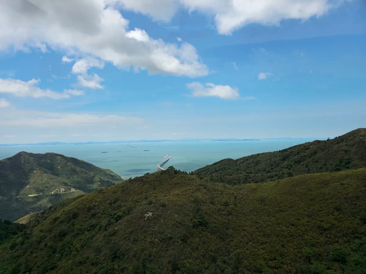 Ngong Ping 360 crosses the green mountains of Lantau Island